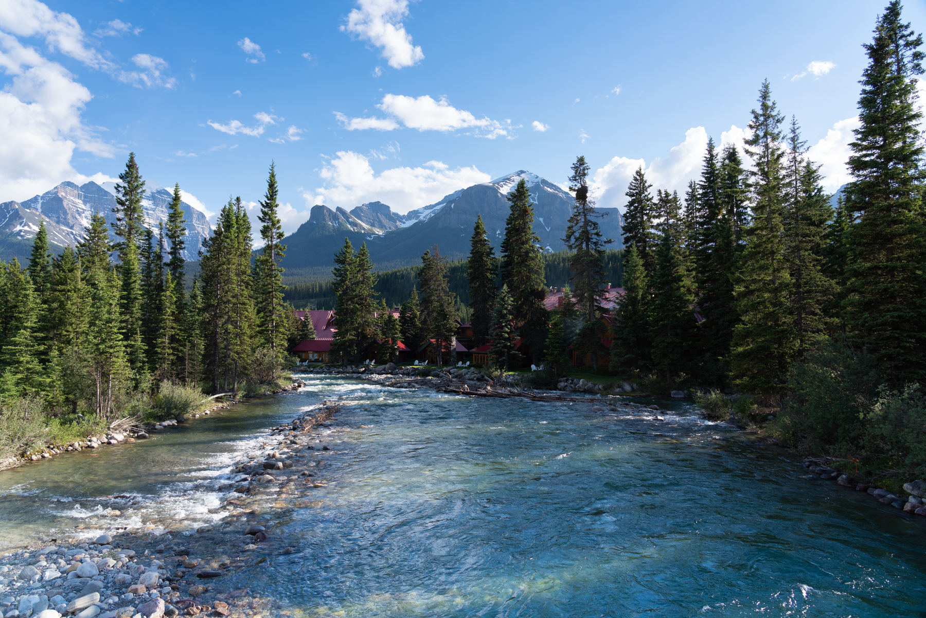 Looking down the Pipestone River to the Post Hotel and Spa in Lake Louise.