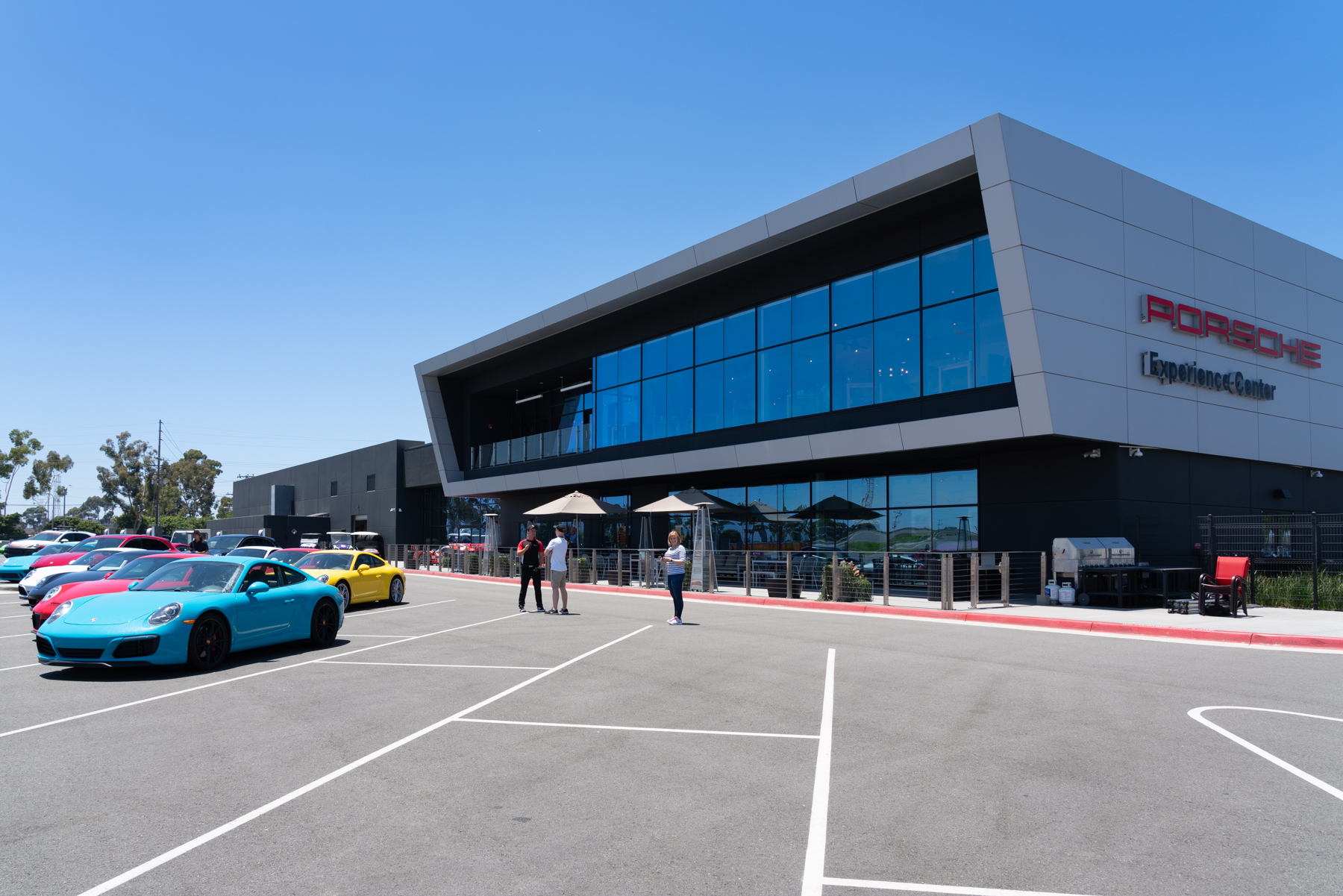 Andrea, and Matt talking with Shawn, at the Porsche Experience Centre.
