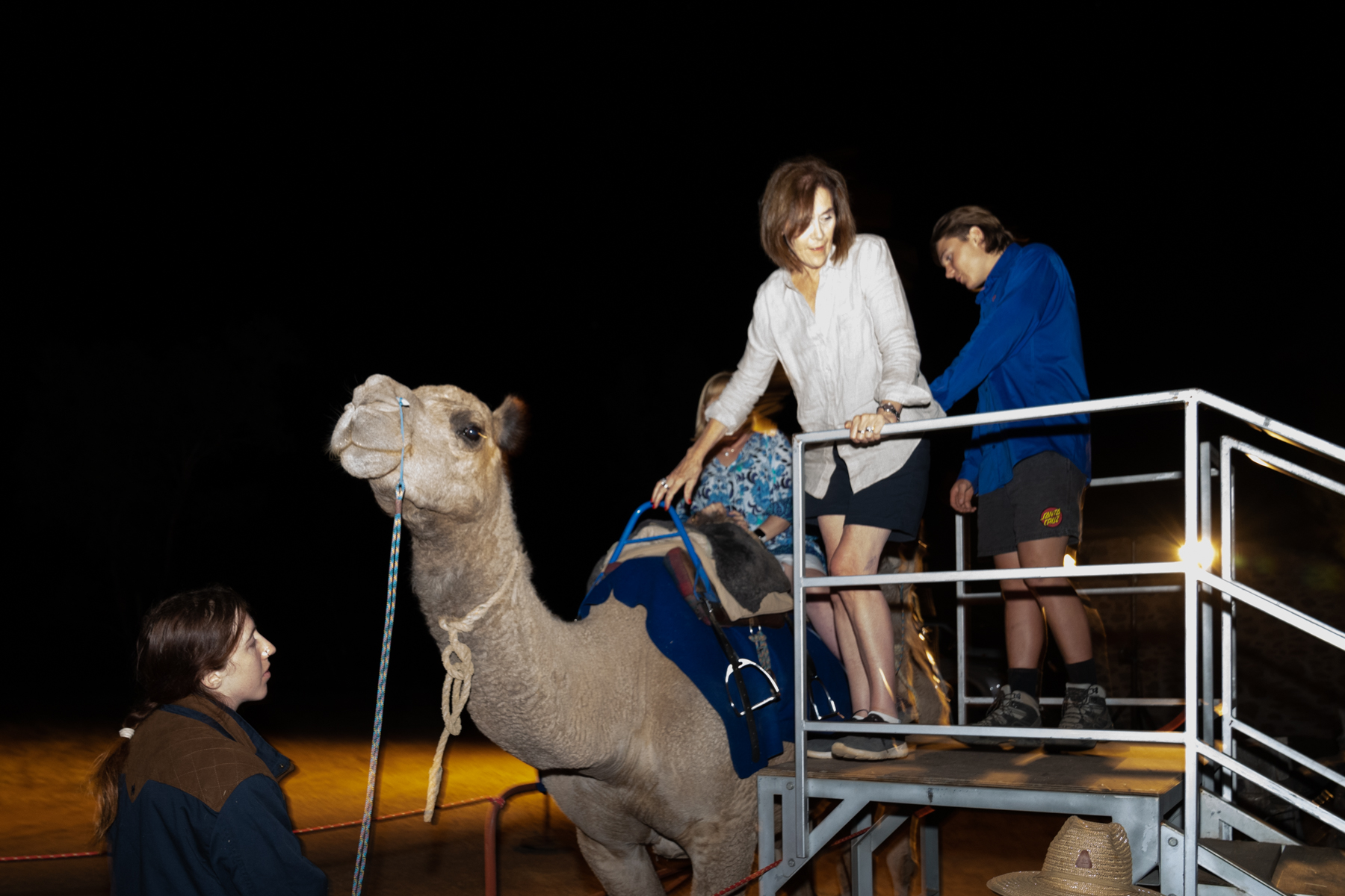 Joy (somewhat reluctantly!) getting on a camel!