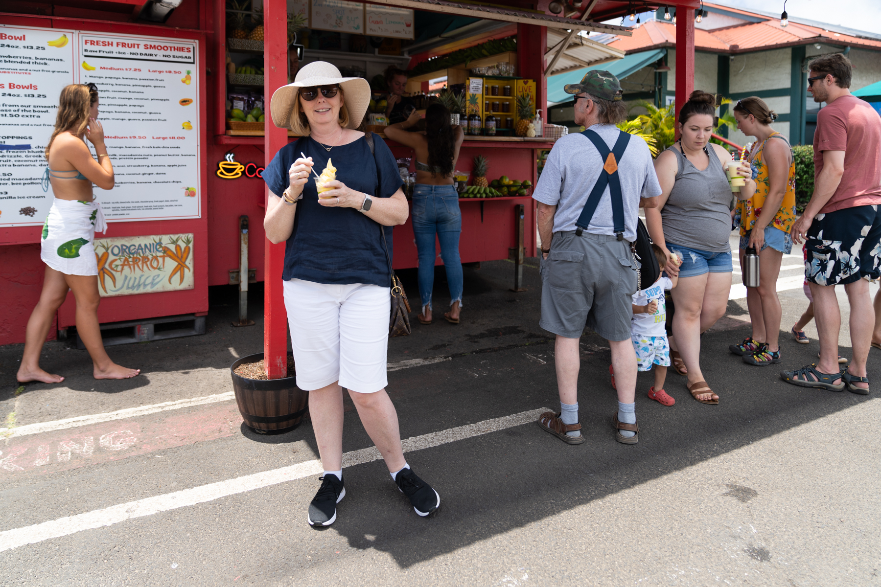 Andrea, enjoying a Dole Whip pineapple soft-serve in Hanalei.