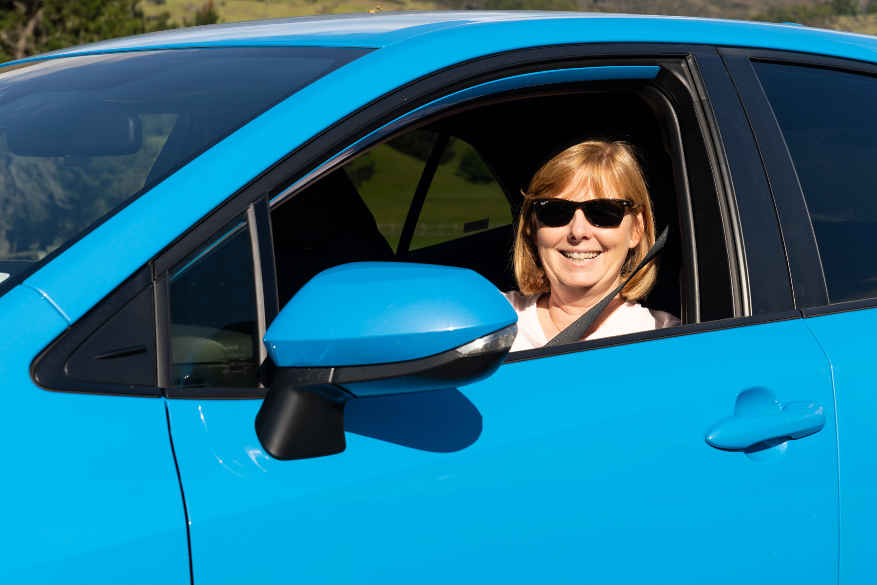 Andrea in our pretty offensive Corolla hire car.