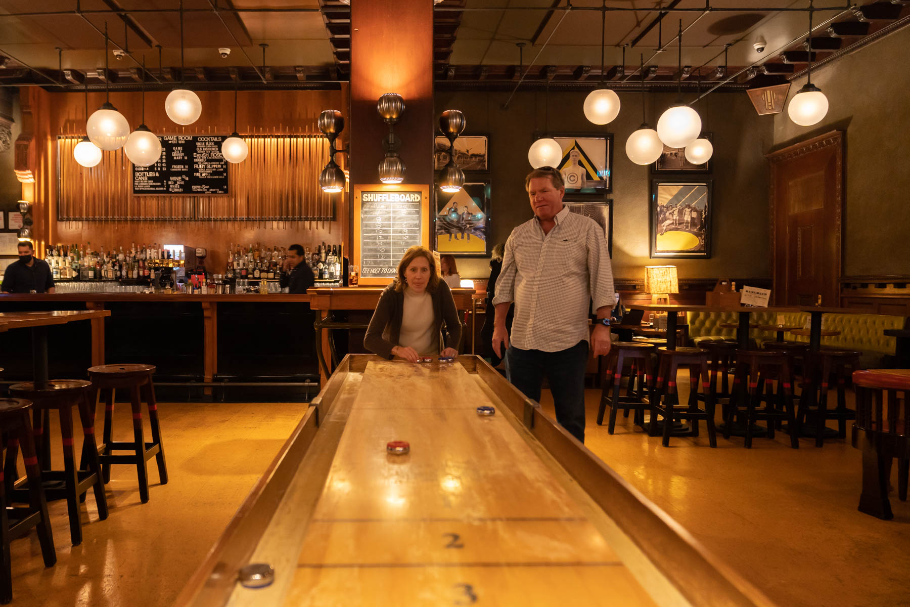 Playing shuffleboard (with Sue very focused on her next play!).