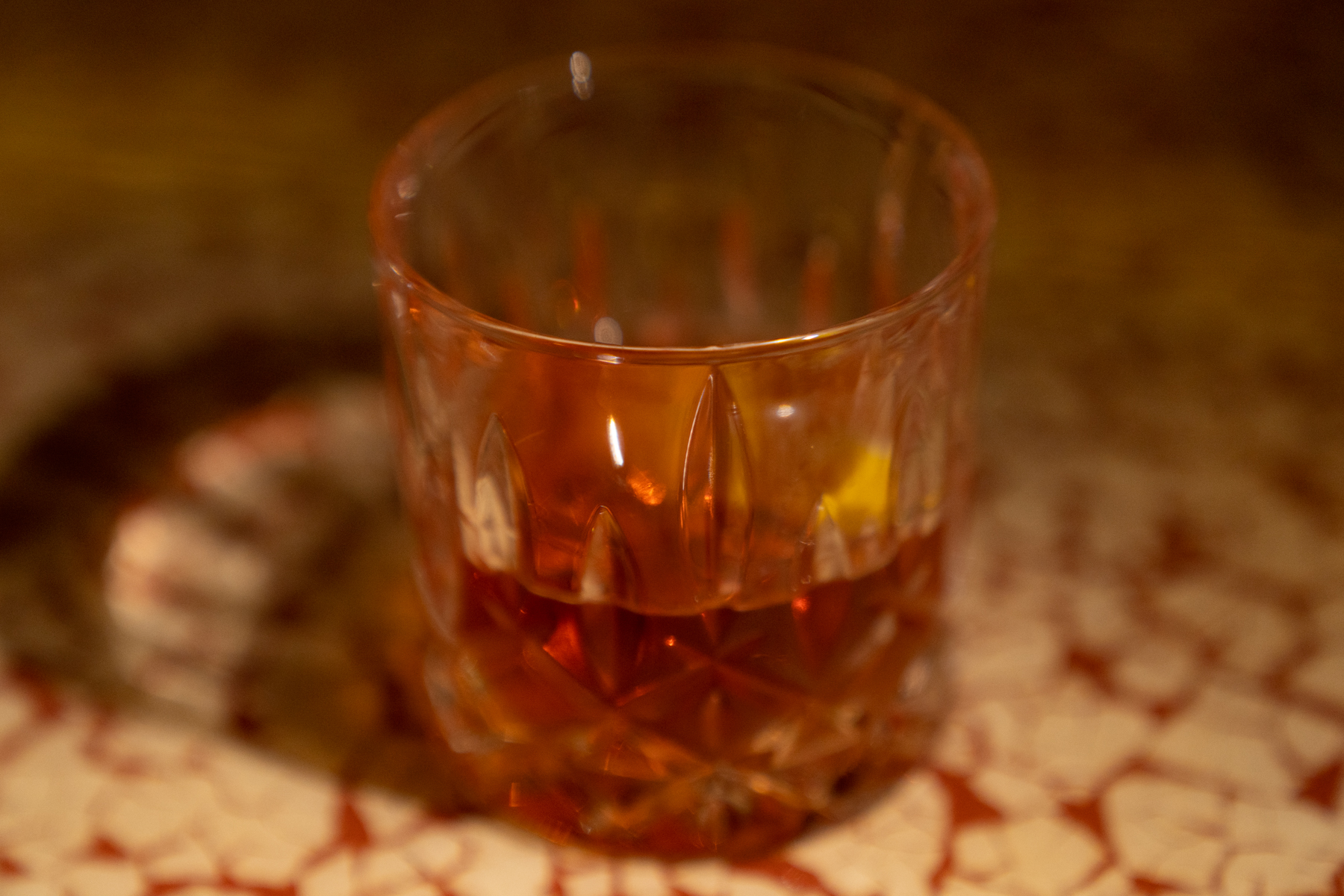 The famous Sazerac cocktail (made with rye whiskey, absinthe, bitters, and sugar).