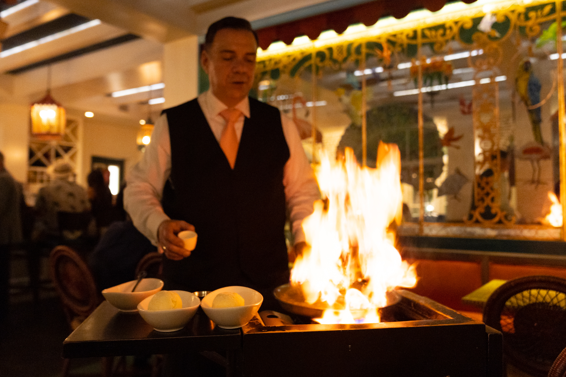Banana Fosters being flambéd at the table.