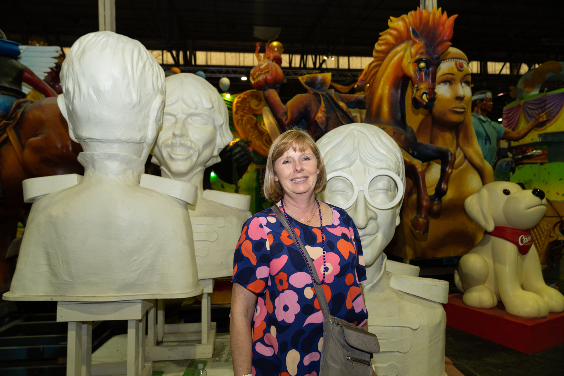 Andrea with some of the props at Mardi Gras World.