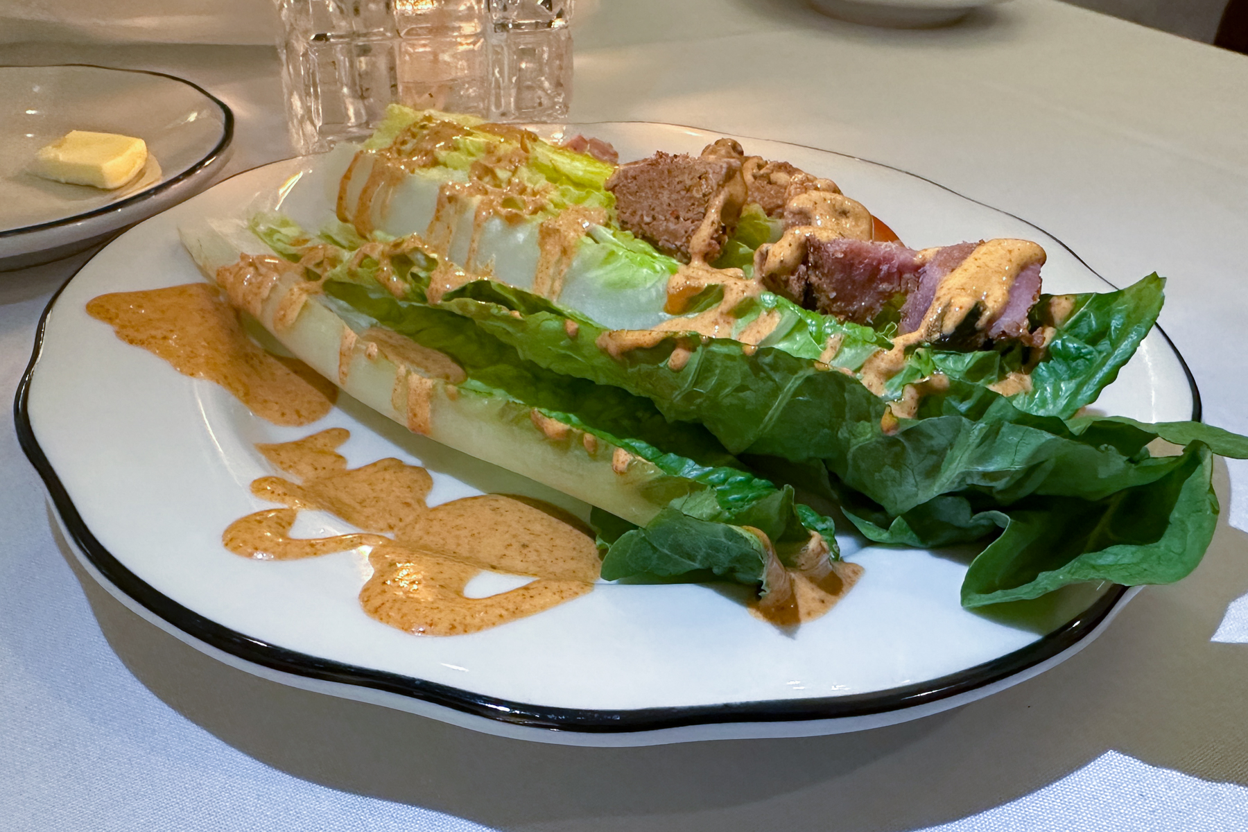 Salad with andouille (a spicy sausage made from smoked pork).