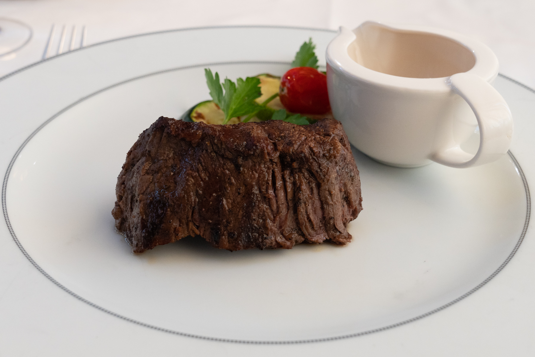 Black Angus filet mignon with peppercorn sauce.