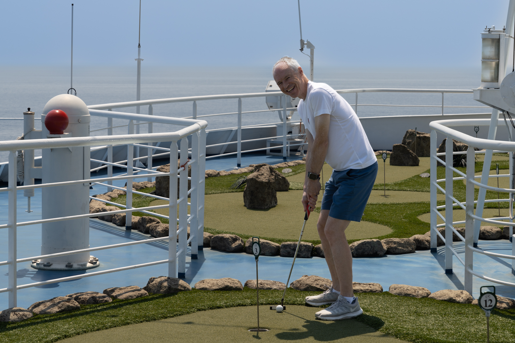 Keith playing mini-golf.