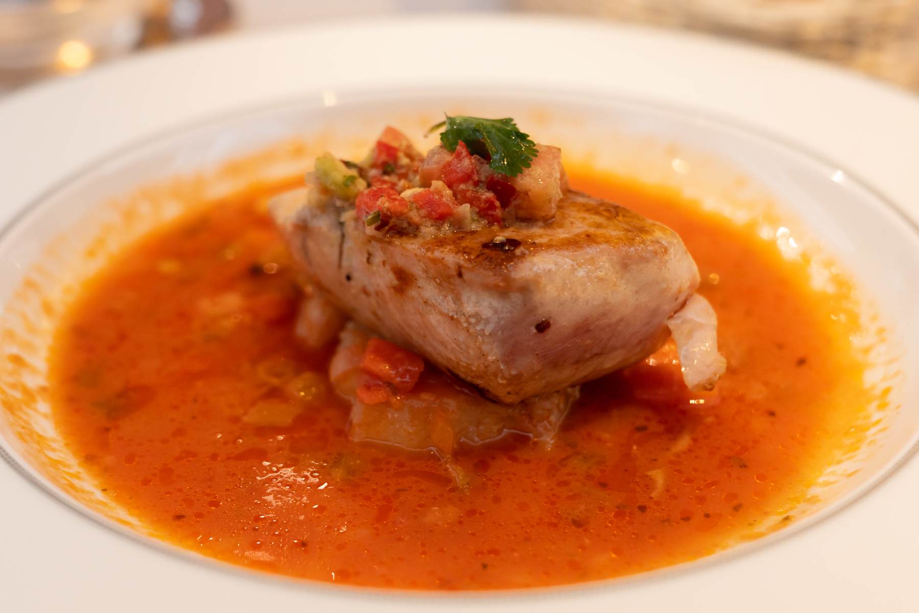 Charred BBQ spiced Mahi-Mahi in creole tomato jus.