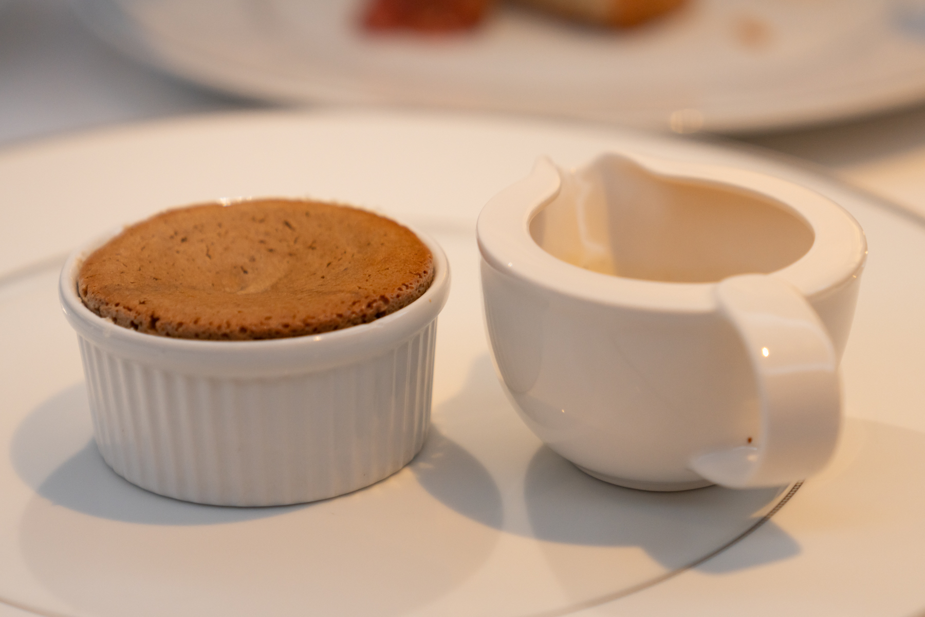 Kahlua coffee soufflé with caramel and vanilla sauce.