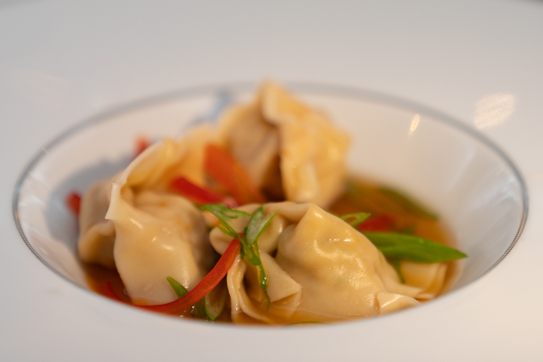Shanghai-style shrimp and pork dumplings in a ginger and soy broth.