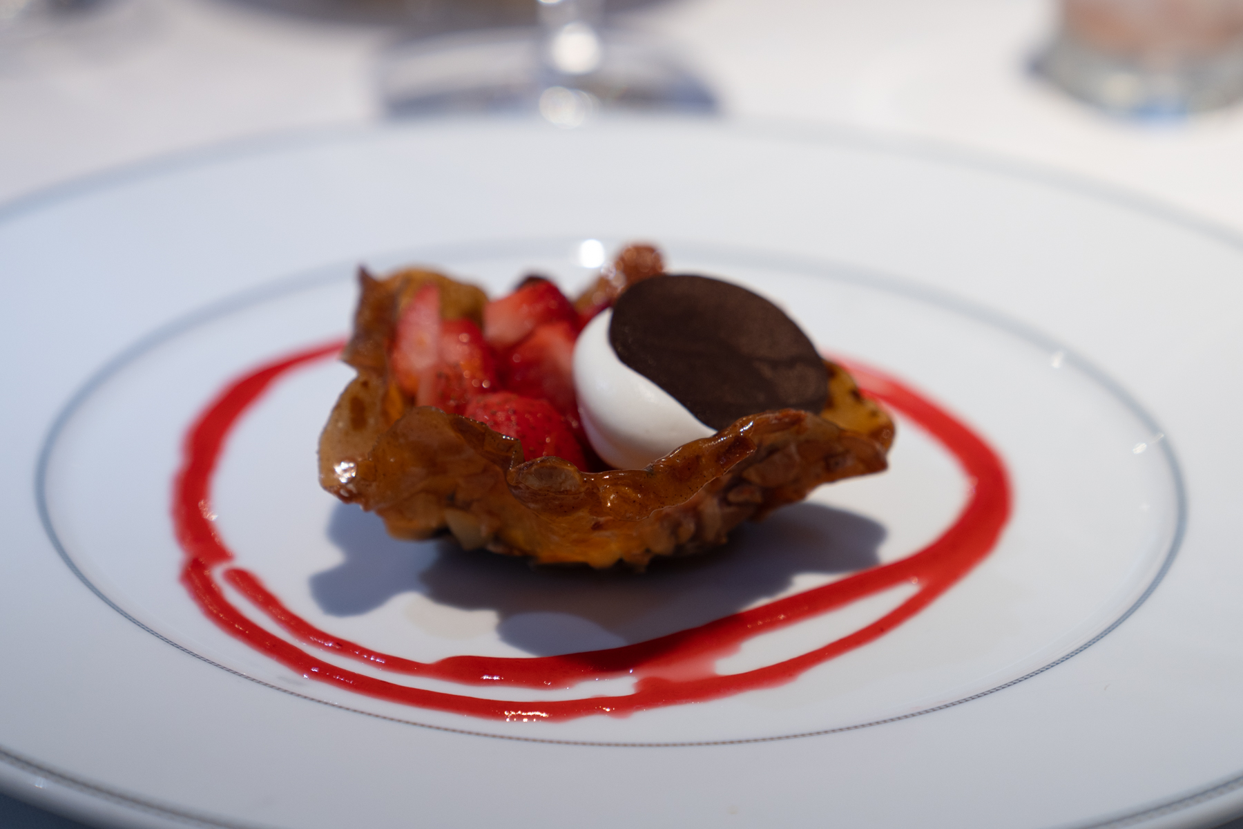 Cointreau strawberries in a brandy snap basket with mascarpone.