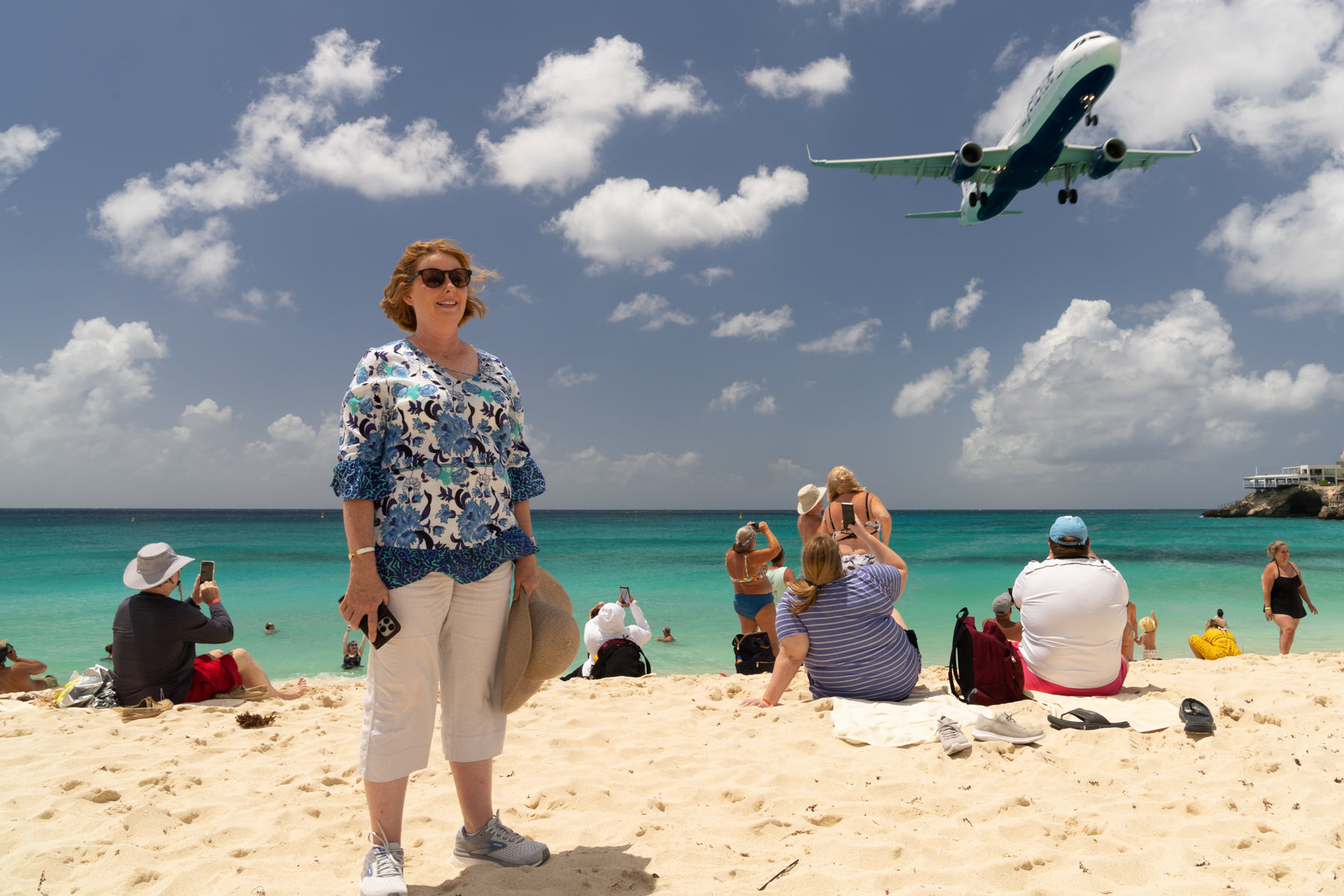 Andrea on Maho Beach as a Jet Blue A321 Airbus from New York comes in to land.