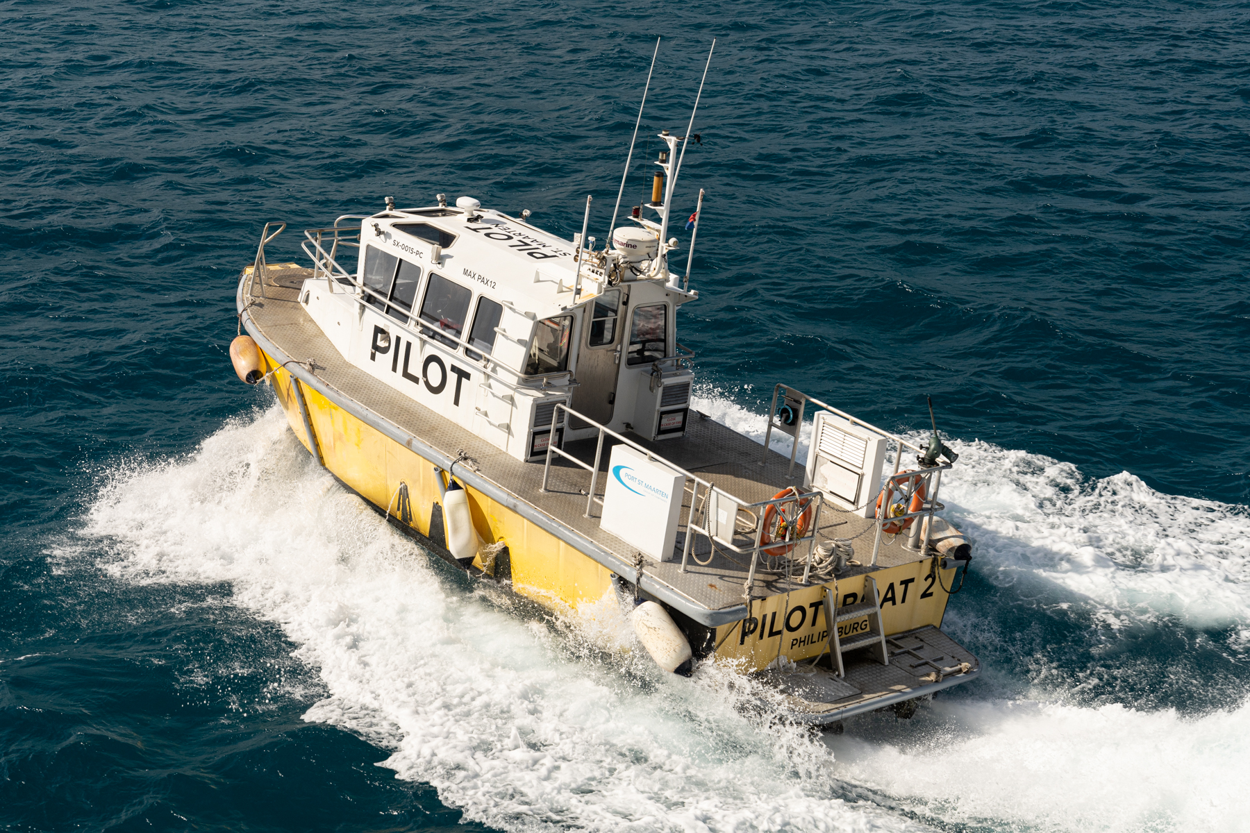 The local pilot boat speeding off after having picked up the harbour pilot from our ship.