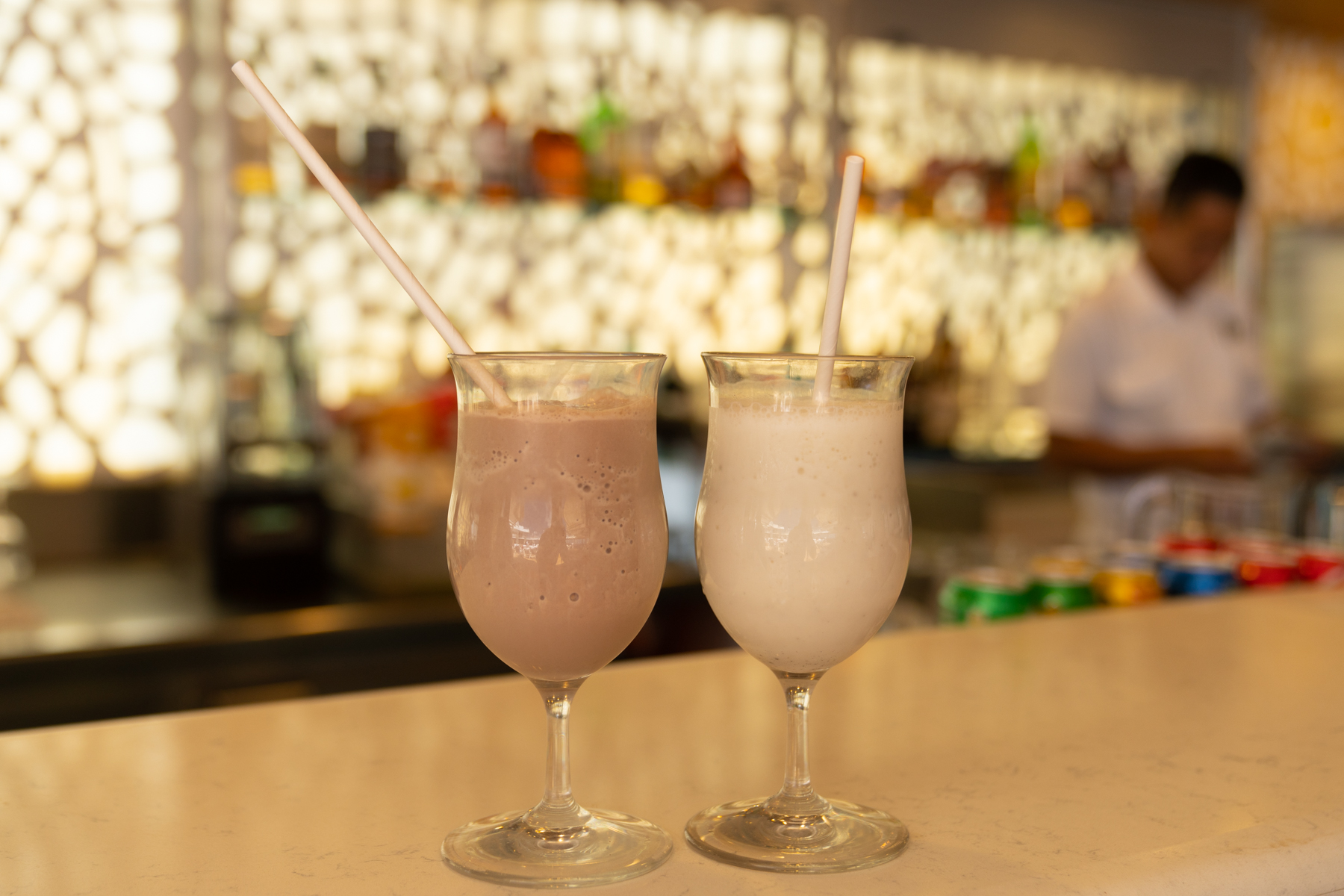 Banana smoothie with chocolate ice-cream and banana smoothie with vanilla ice-cream.