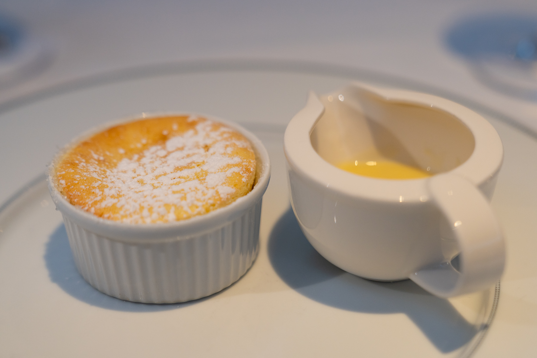 Passion fruit soufflé with coconut and rum sauce.