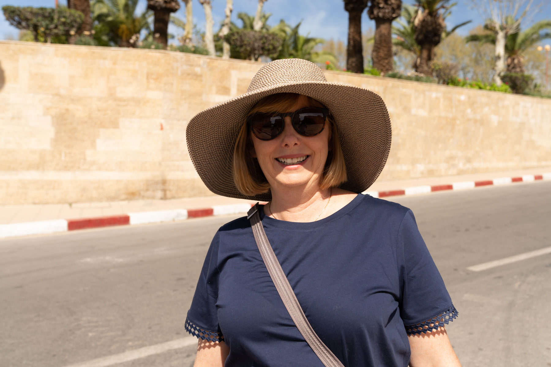 Andrea outside the wall of Dar al-Makhzen.