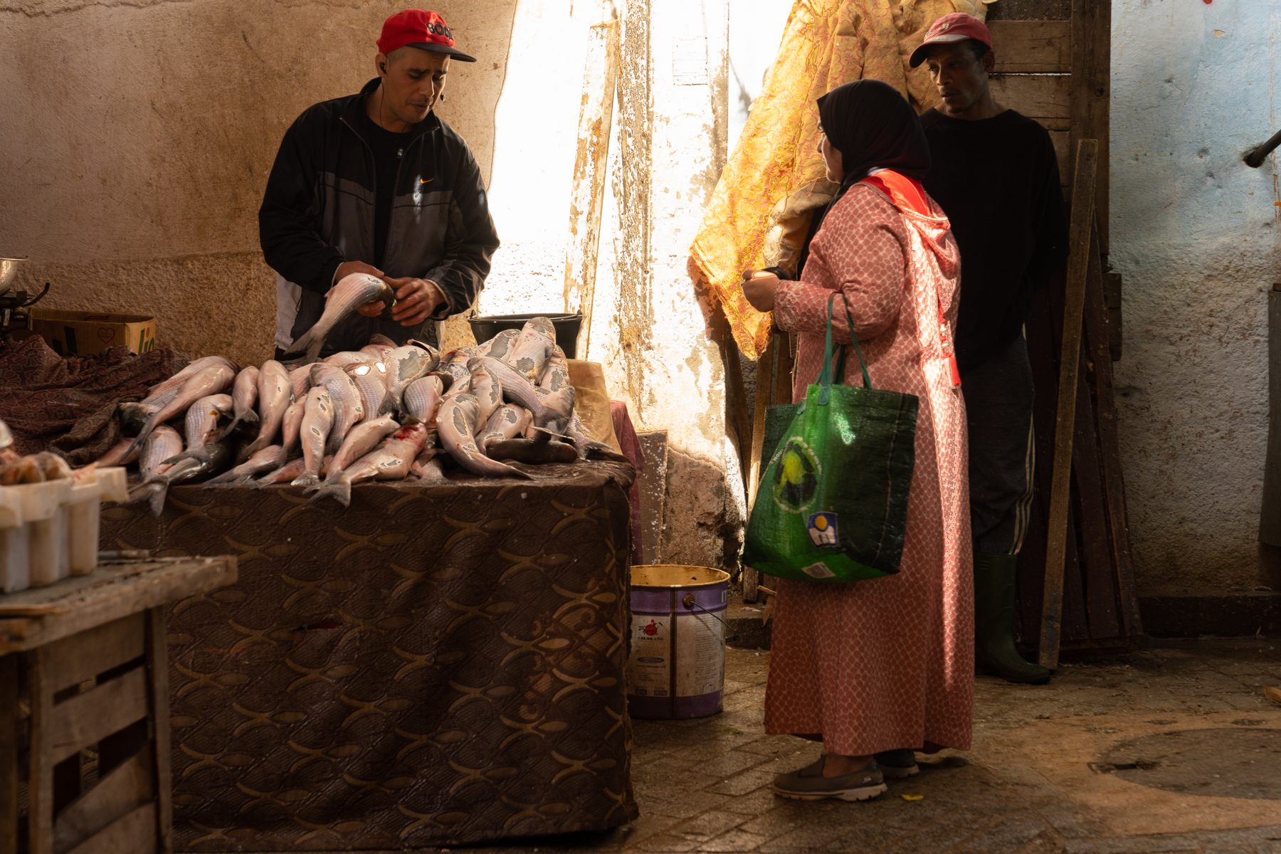 A woman buying fish.