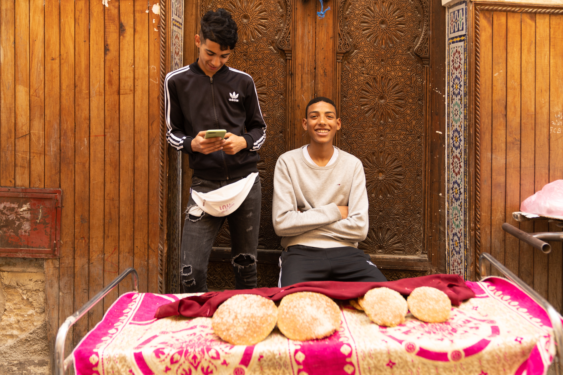 Young boys selling bread.