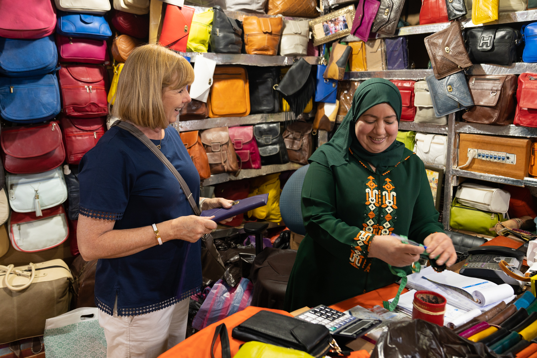 Andrea haggling in a leather store at the Chaouwara Tanneries.