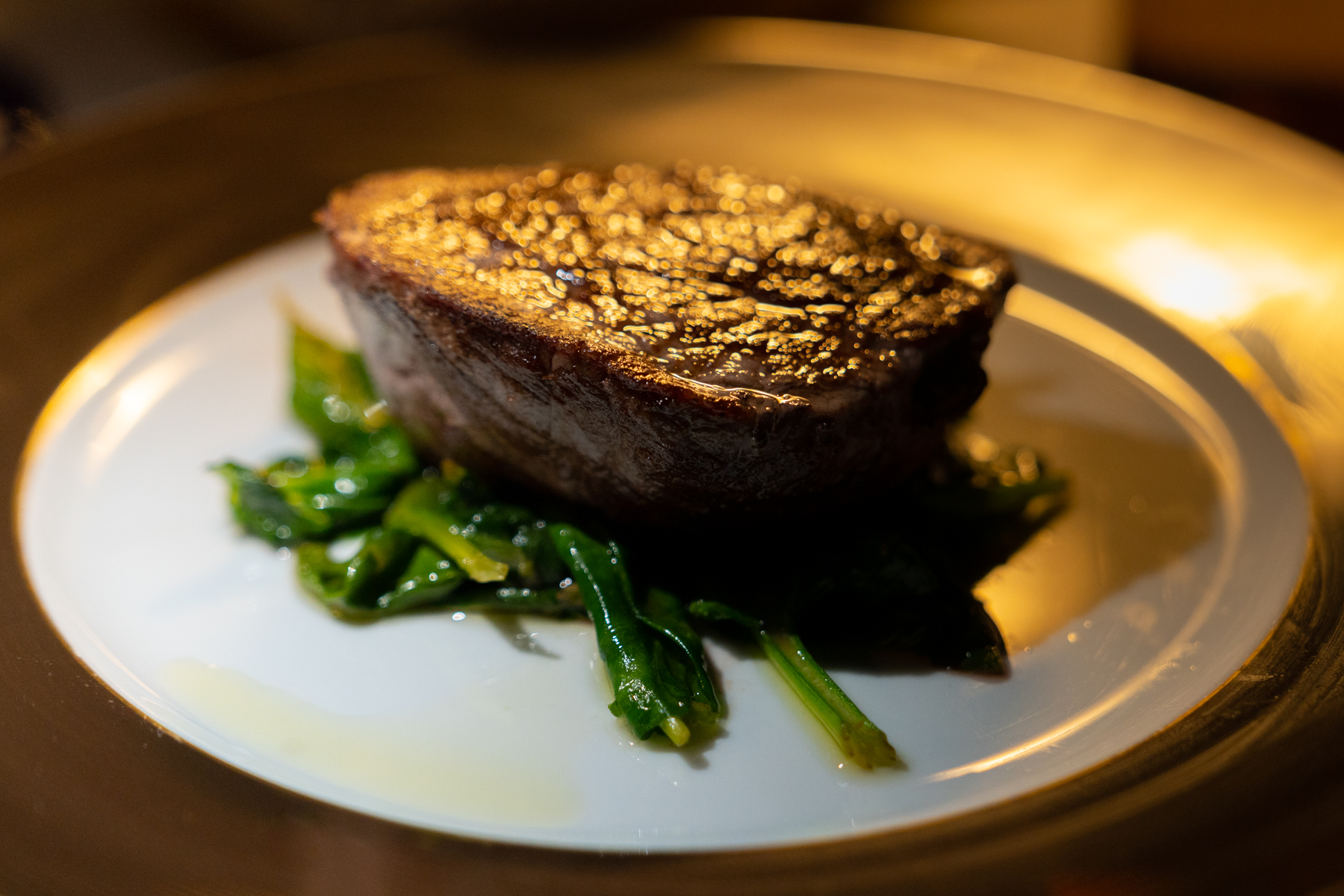 Fillet of beef on sautéed spinach.