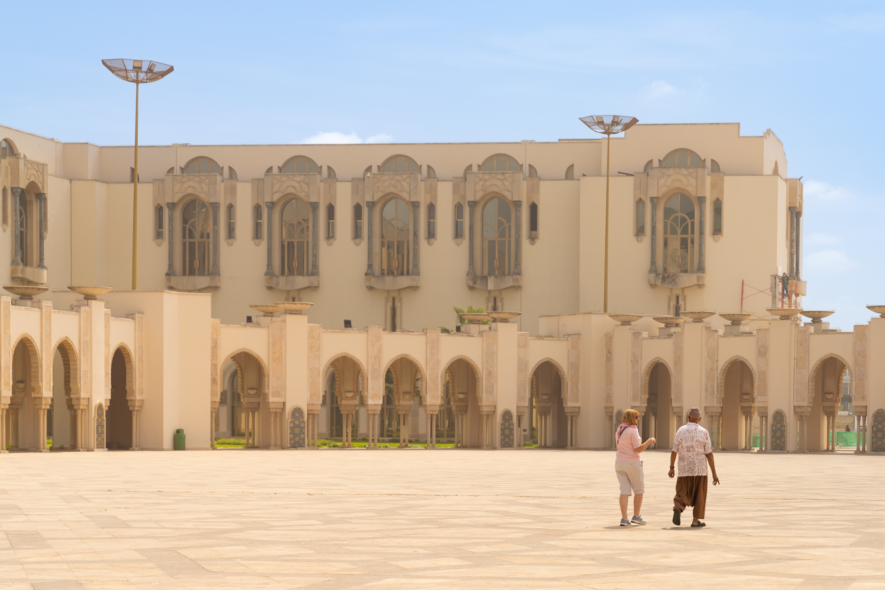 Andrea and Mohamed walking at the Hassan II Mosque.