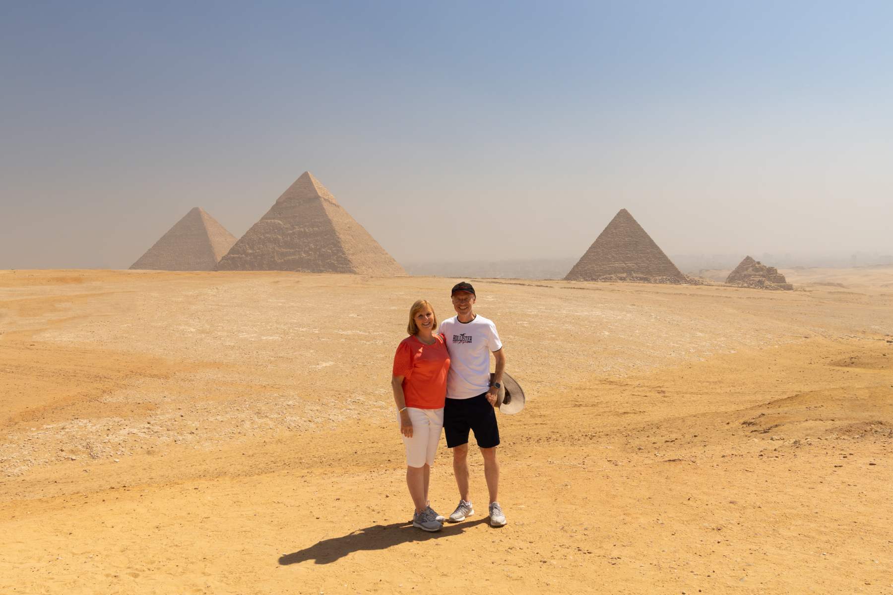 Andrea and Keith with the three main pyramids at Giza in the background.