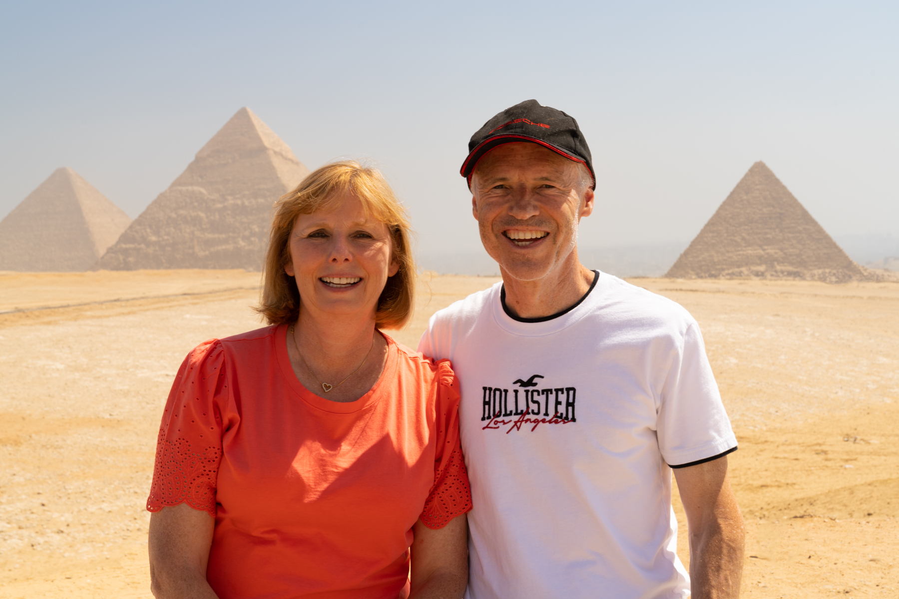 Andrea and Keith with the three main pyramids at Giza in the background.