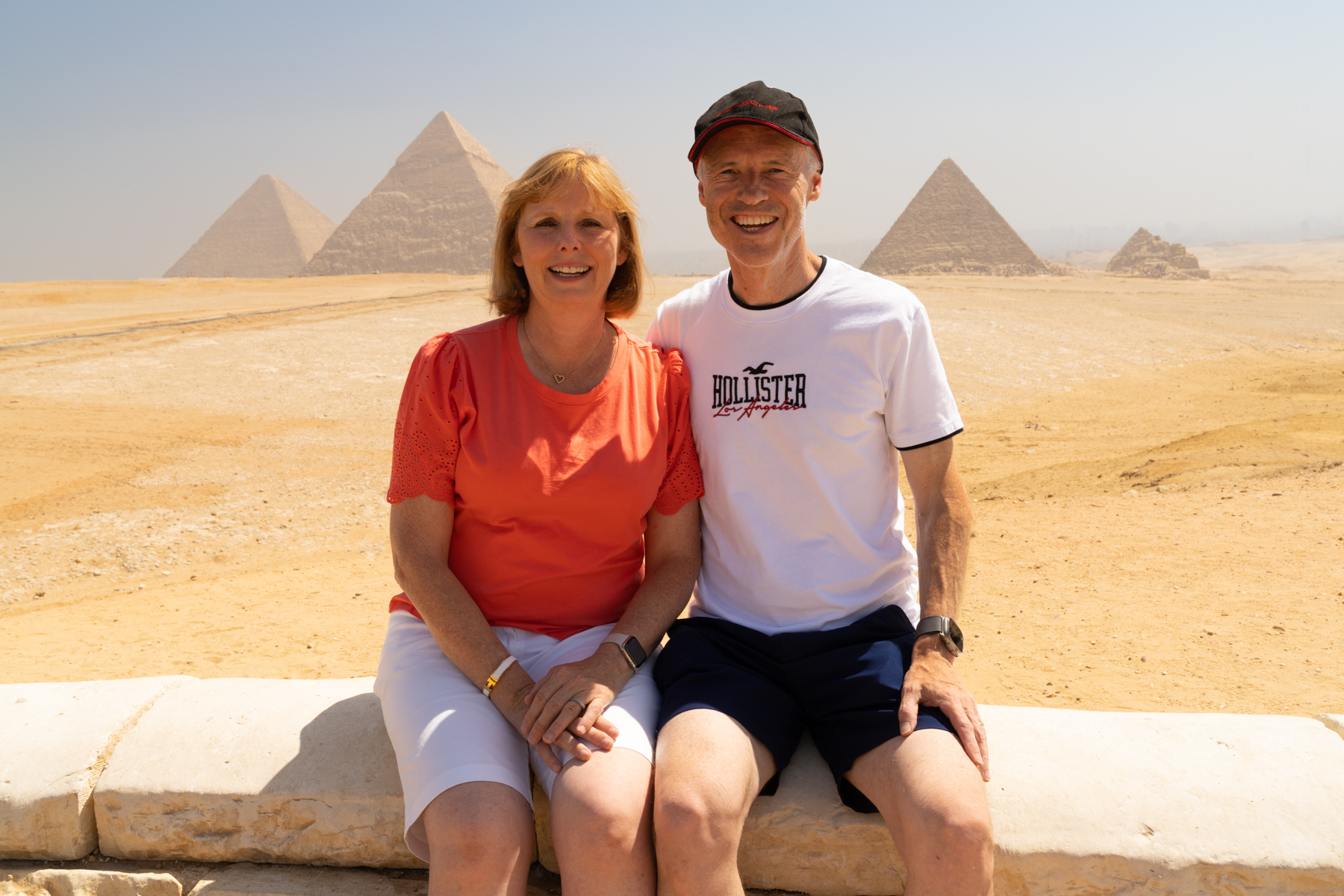 Andrea and Keith with the three main pyramids at Giza in the background.