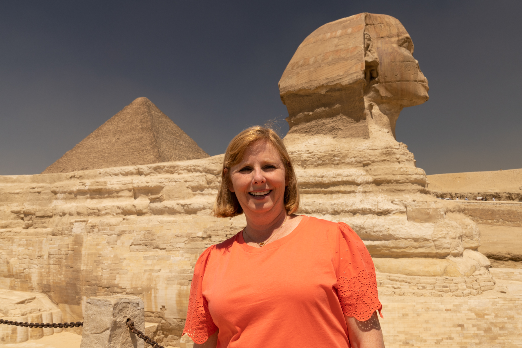 Andrea at the Great Sphinx with the Great Pyramid in the background.