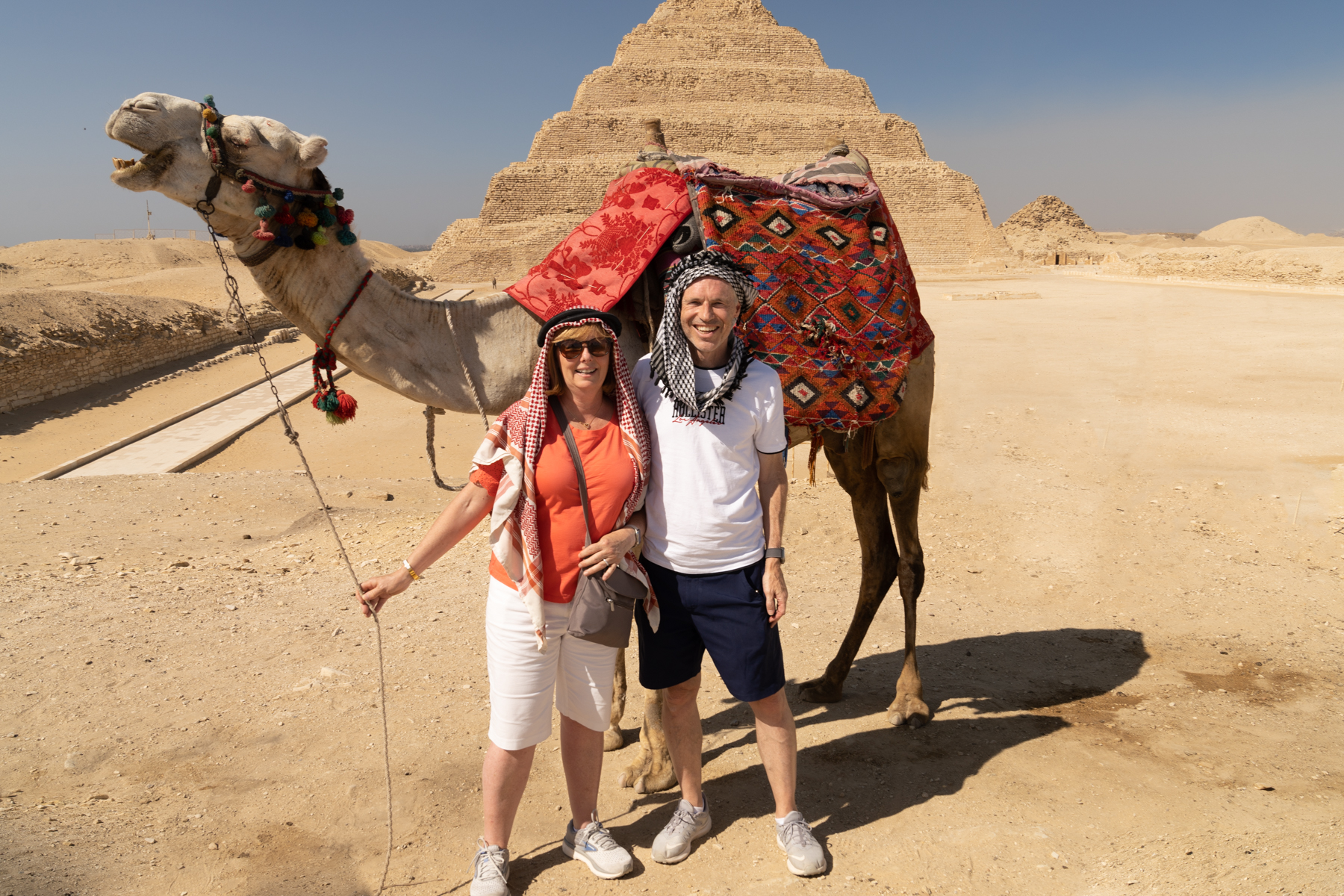 Keith and Andrea with a local camel in front of the Pyramid of Djoser.