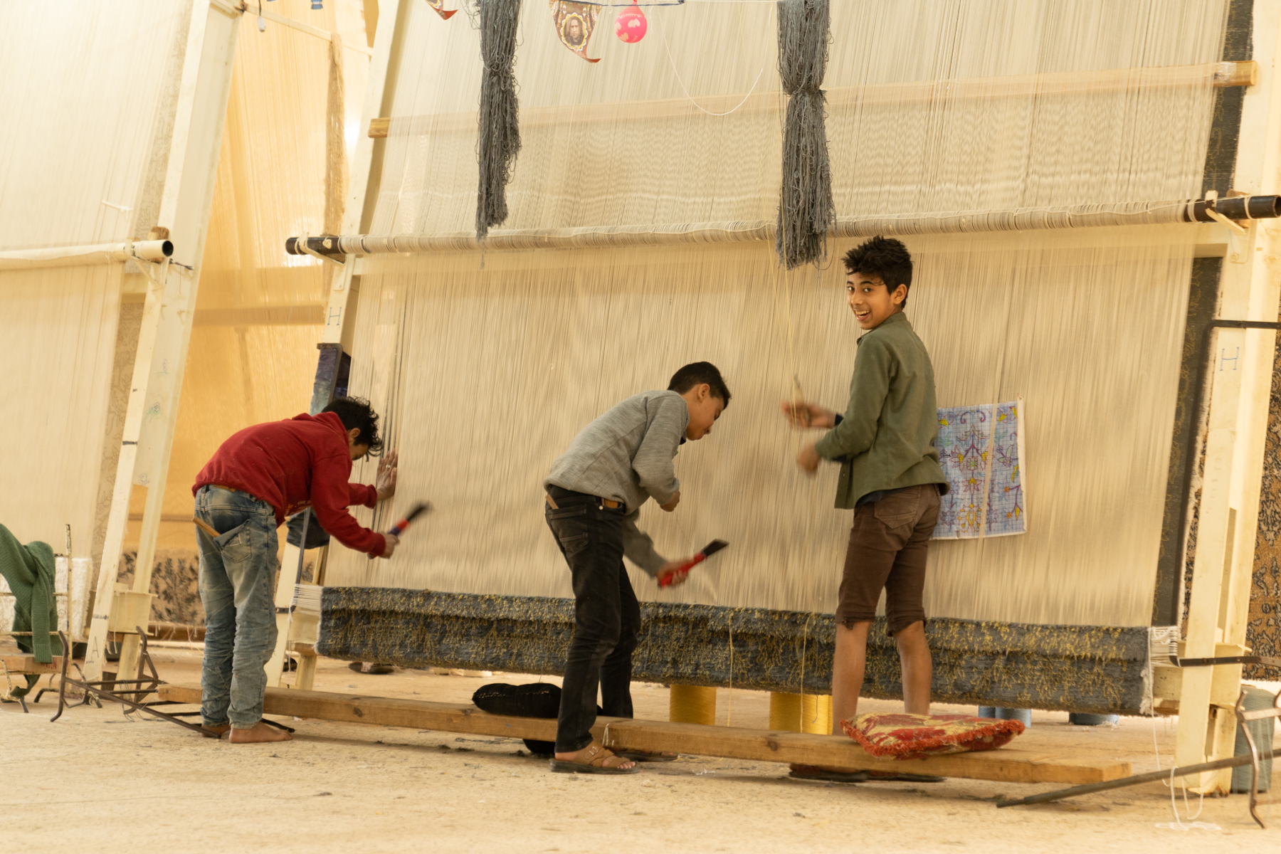 Children at the Oriental Carpet School in Saqqara, making a rug.