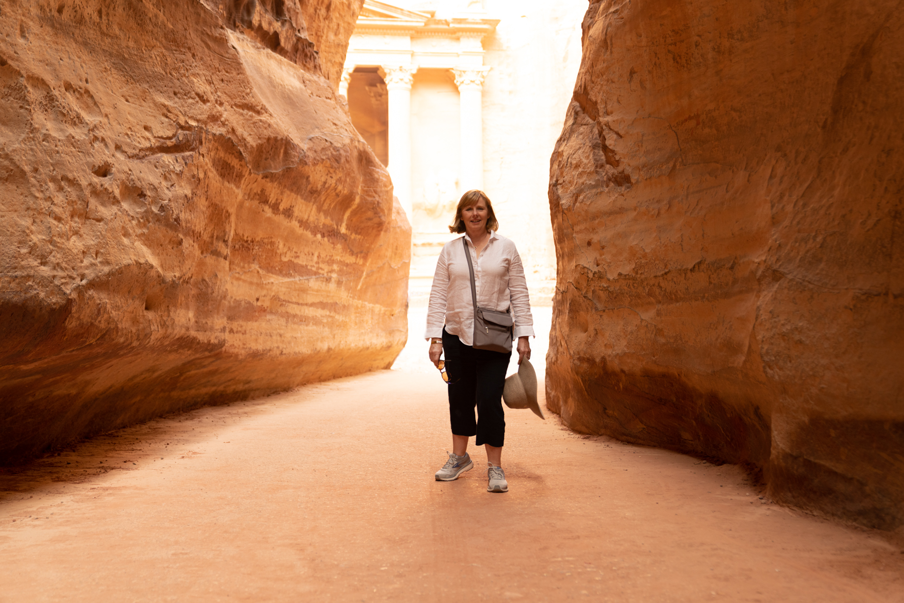 Andrea at the end of the Siq, with Al-Khazneh in the background.