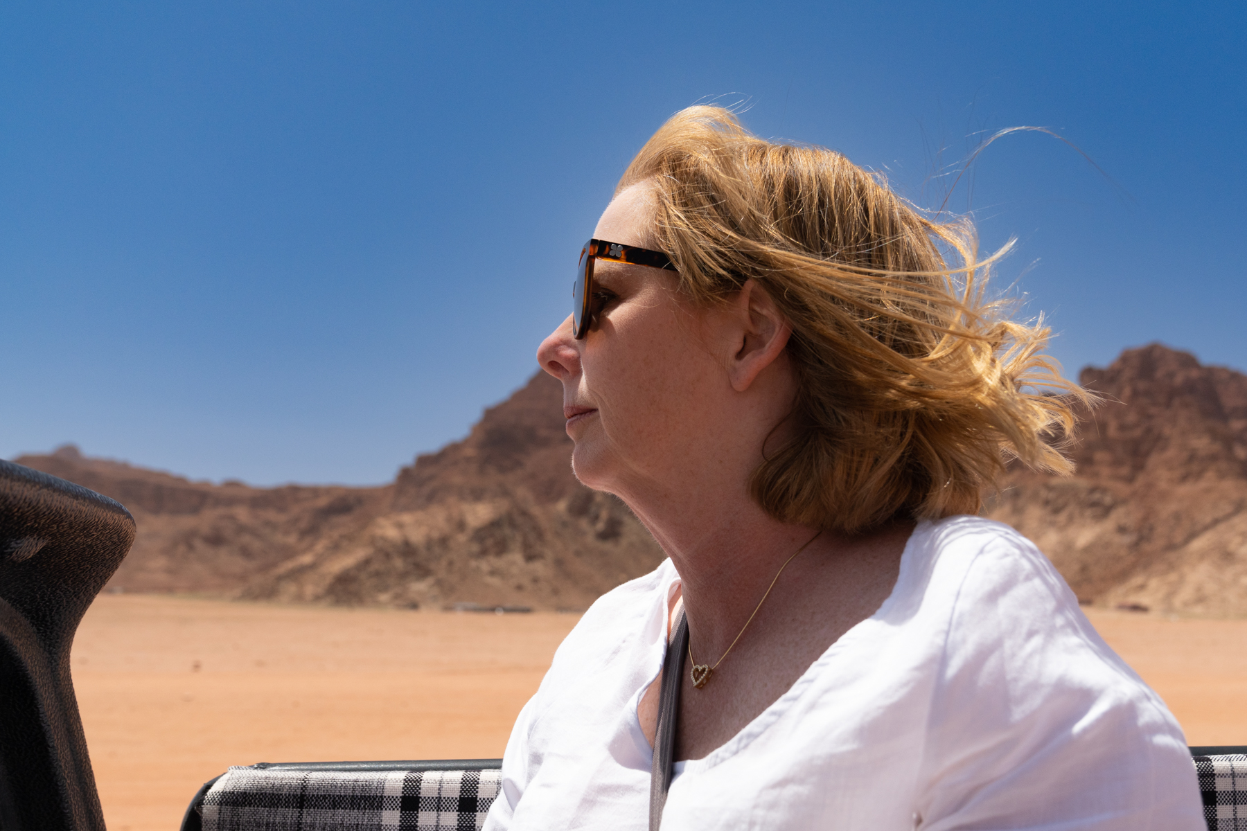 Andrea enjoying the "air conditioning" on the drive through the desert.
