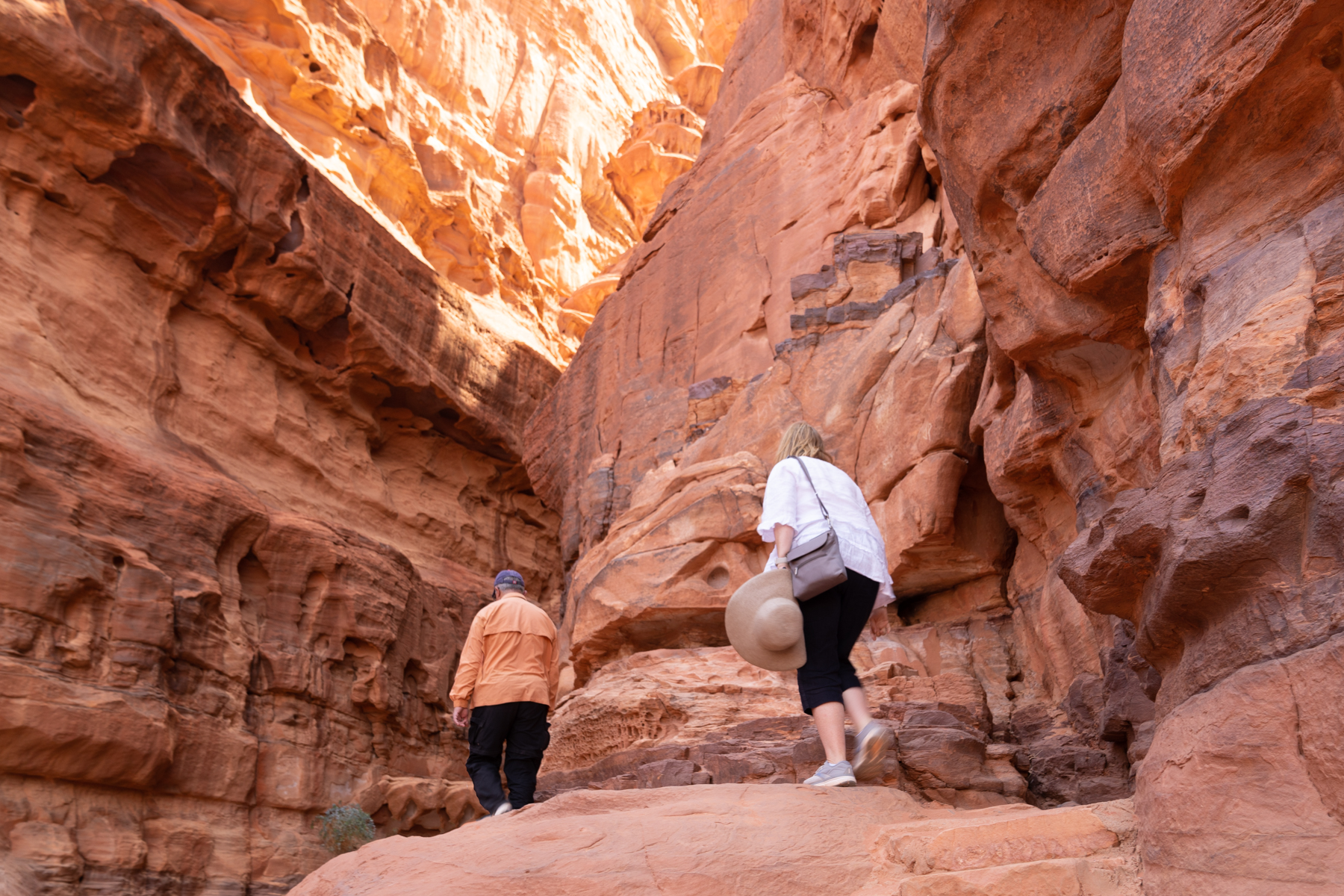 Andrea and Daoud heading into the canyon at Jabal Khazali.
