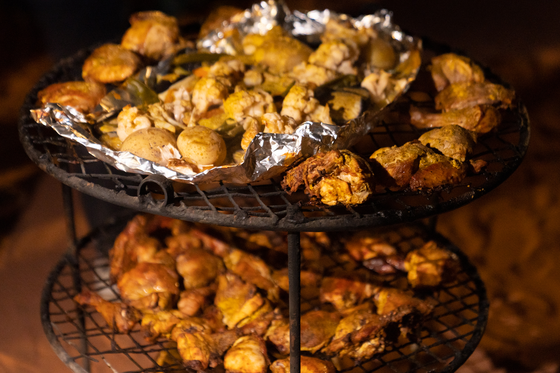 Dinner coming out of the zarb (an in-ground Bedouin oven).