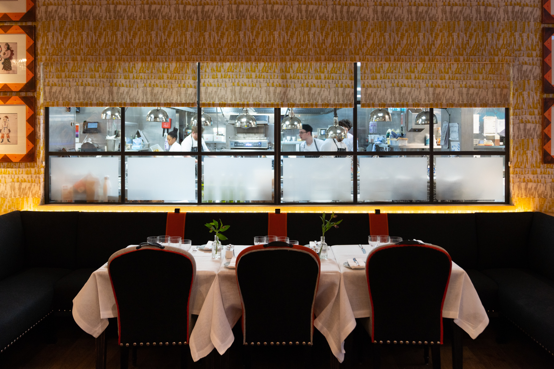Looking into the restaurant kitchen at breakfast at the Ham Yard Hotel.