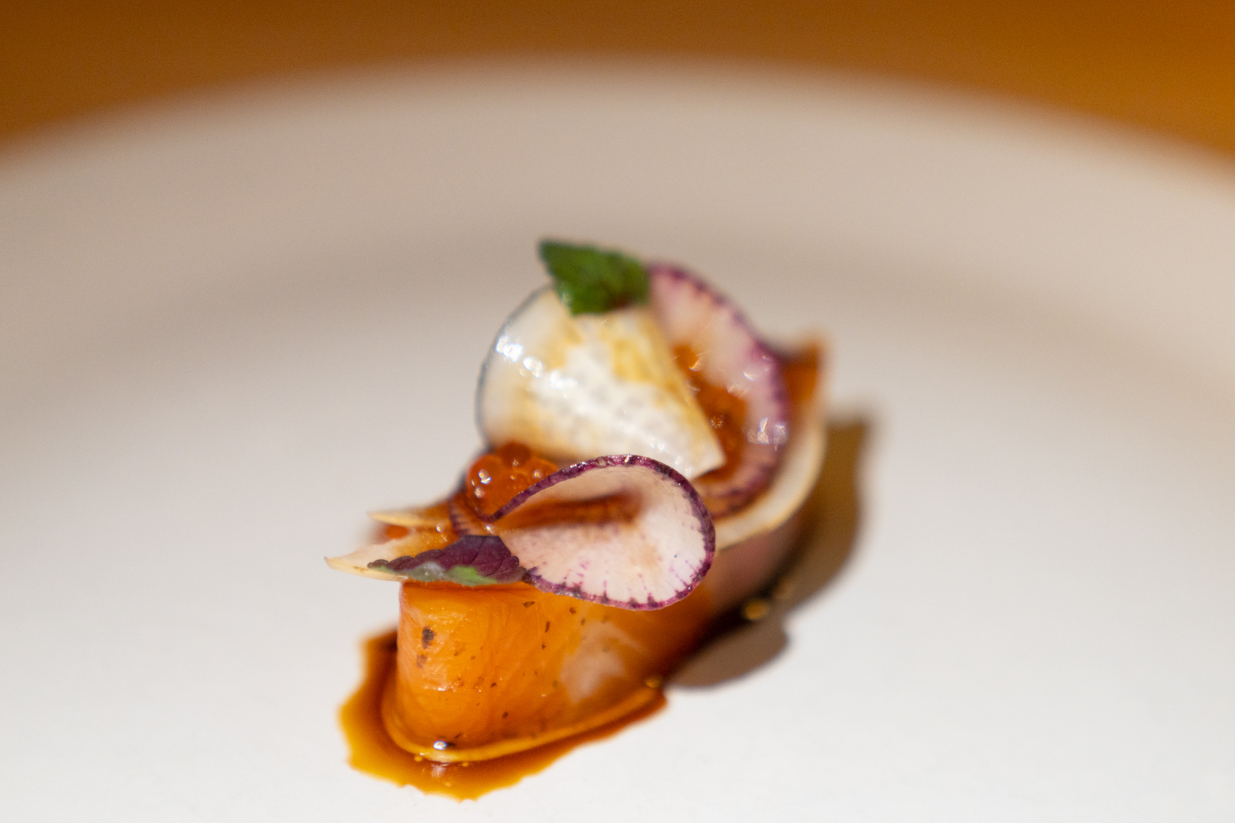 Sake cured Chalk Stream trout with kombu dressing and radish.