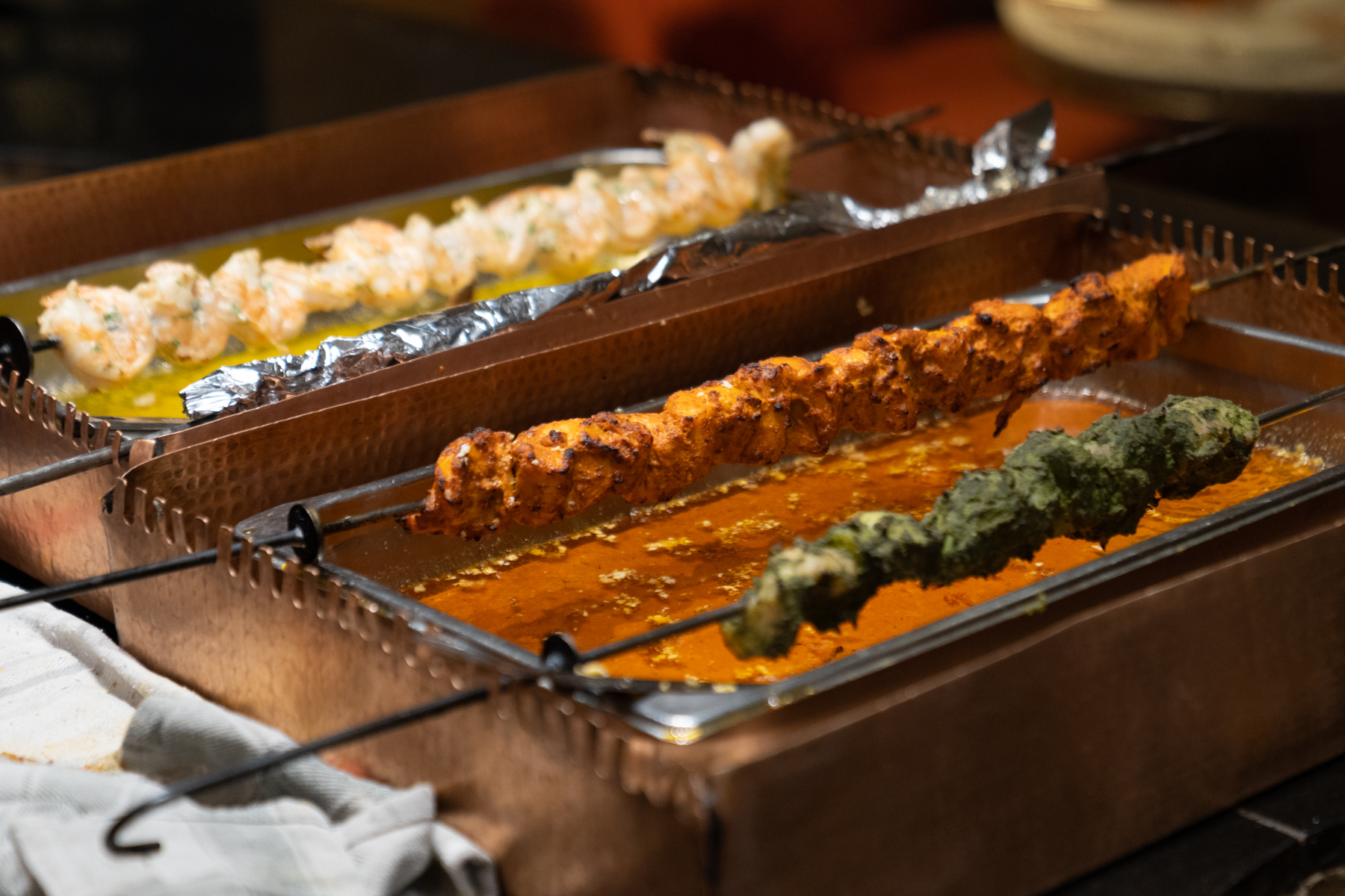 Just-cooked kebabs out of the tandoor.