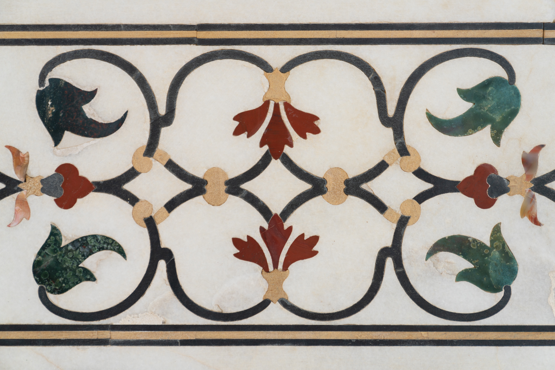 Pattern made from inlaid semi-precious stones on the exterior of the Taj Mahal.