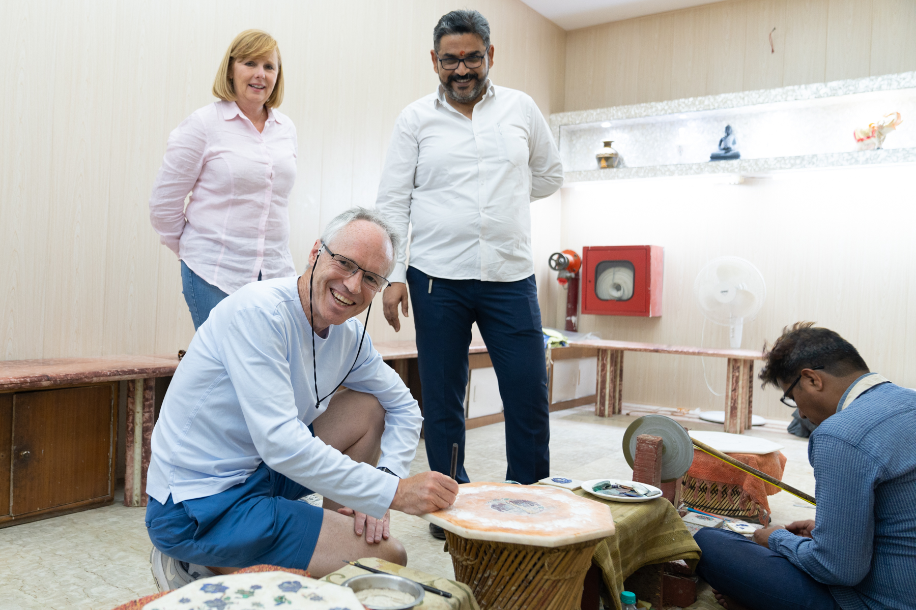 keith trying out his carving skills in a piece of marble.