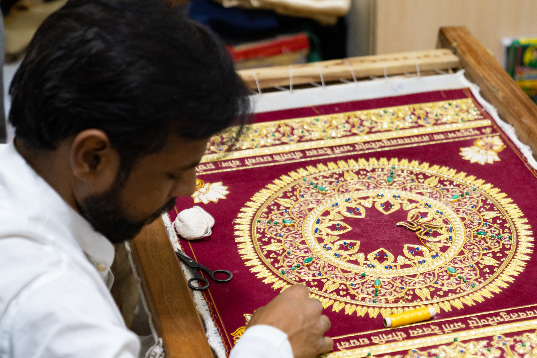 A student learning traditional embroidery techniques.