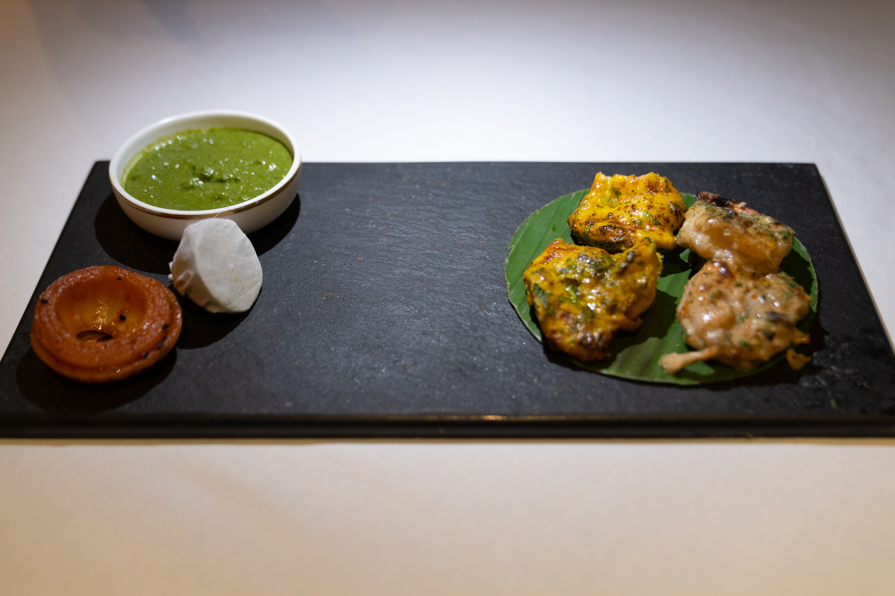 Tandoori prawn kebab in a citrus cream marinade and tandoori chicken breast in a saffron egg crust.