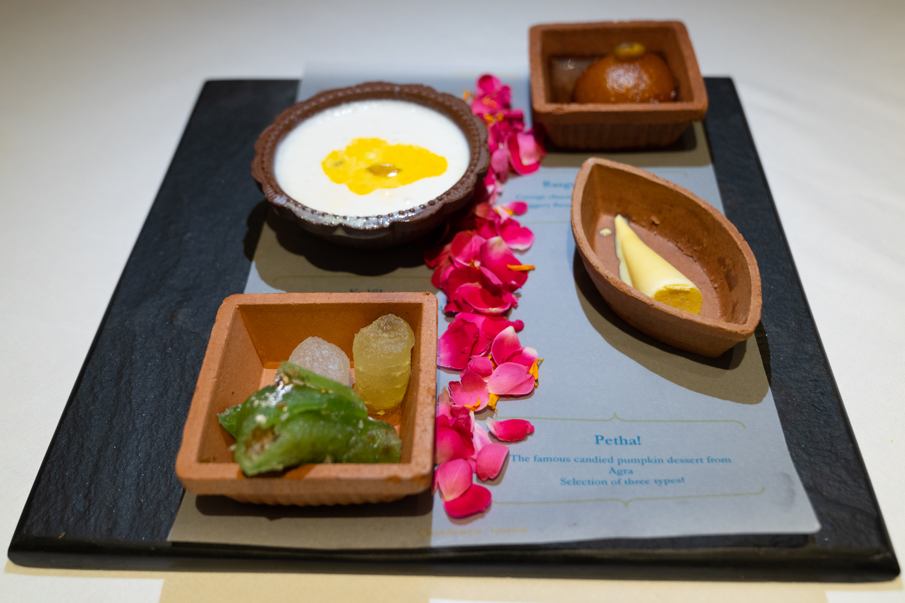 Milk dumplings with pistachio and cardamon, cottage cheese dumplings slow cooked in jaggery-flavoured milk, saffron and pistachio ice-cream, and three flavours of candied pumpkin.