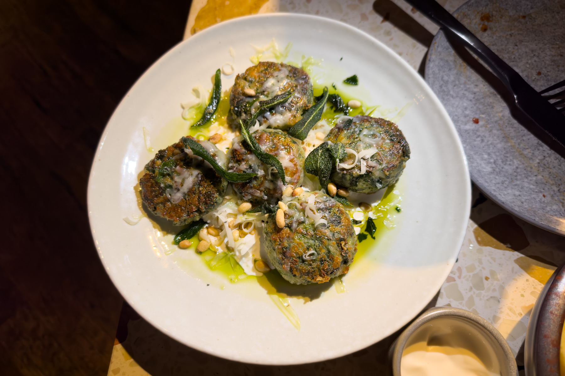 Spinach and burrata gnudi with brown butter, sage, and pine nuts.