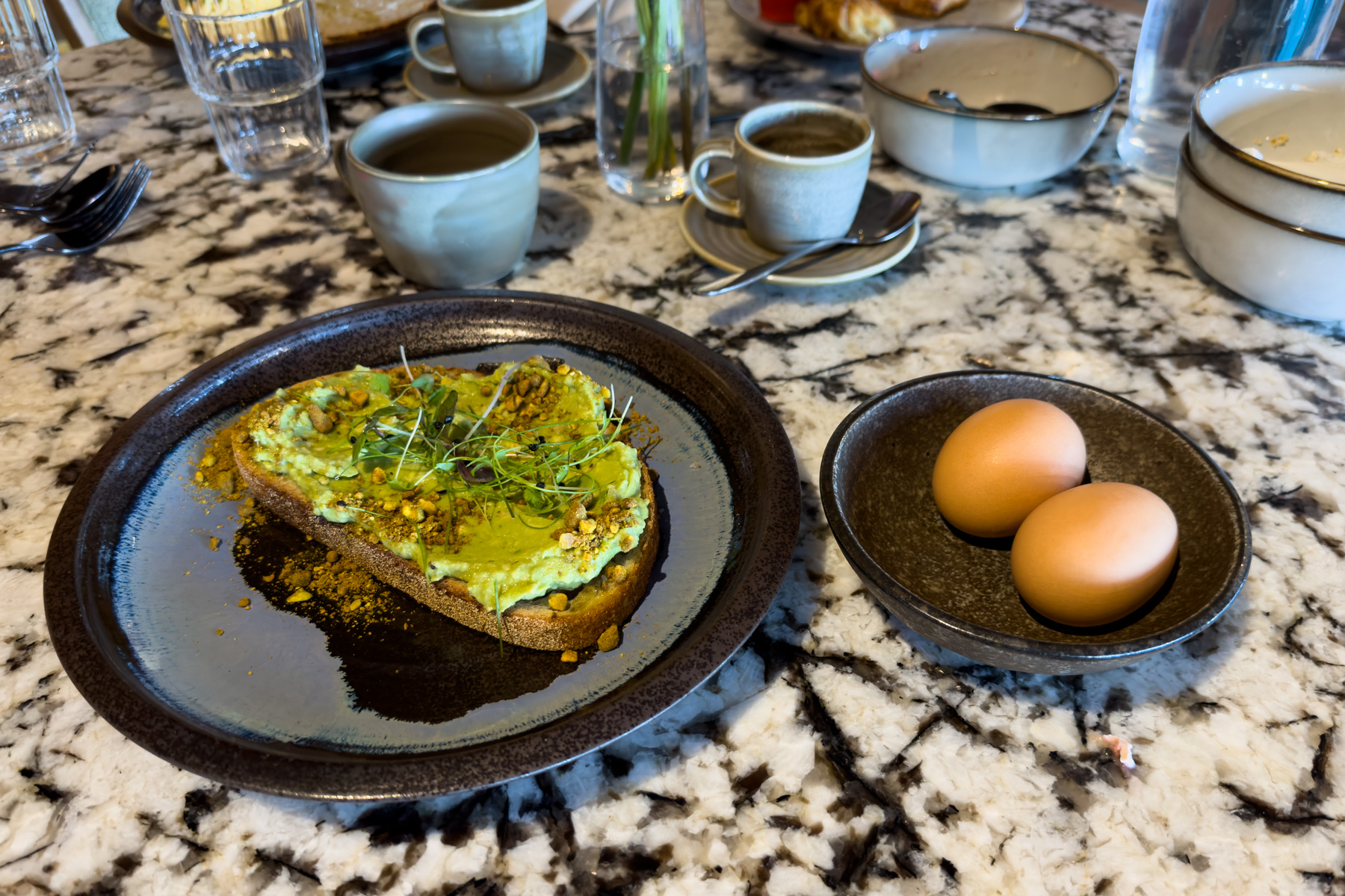 Avocado on sourdough with boiled eggs.