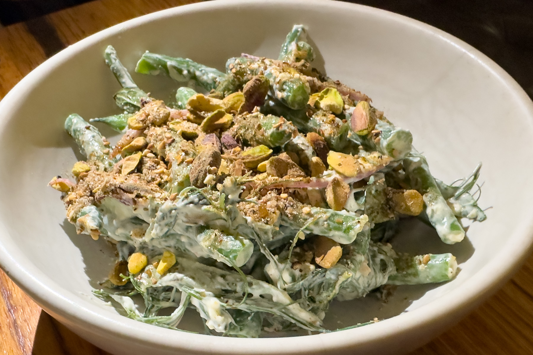 Green beans with peta, preserved lemon, and pistachios,