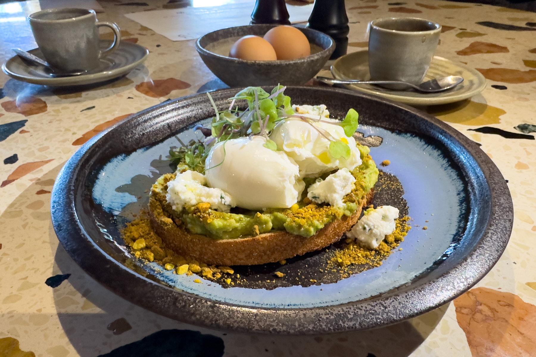 Avocado with poached eggs on sourdough.