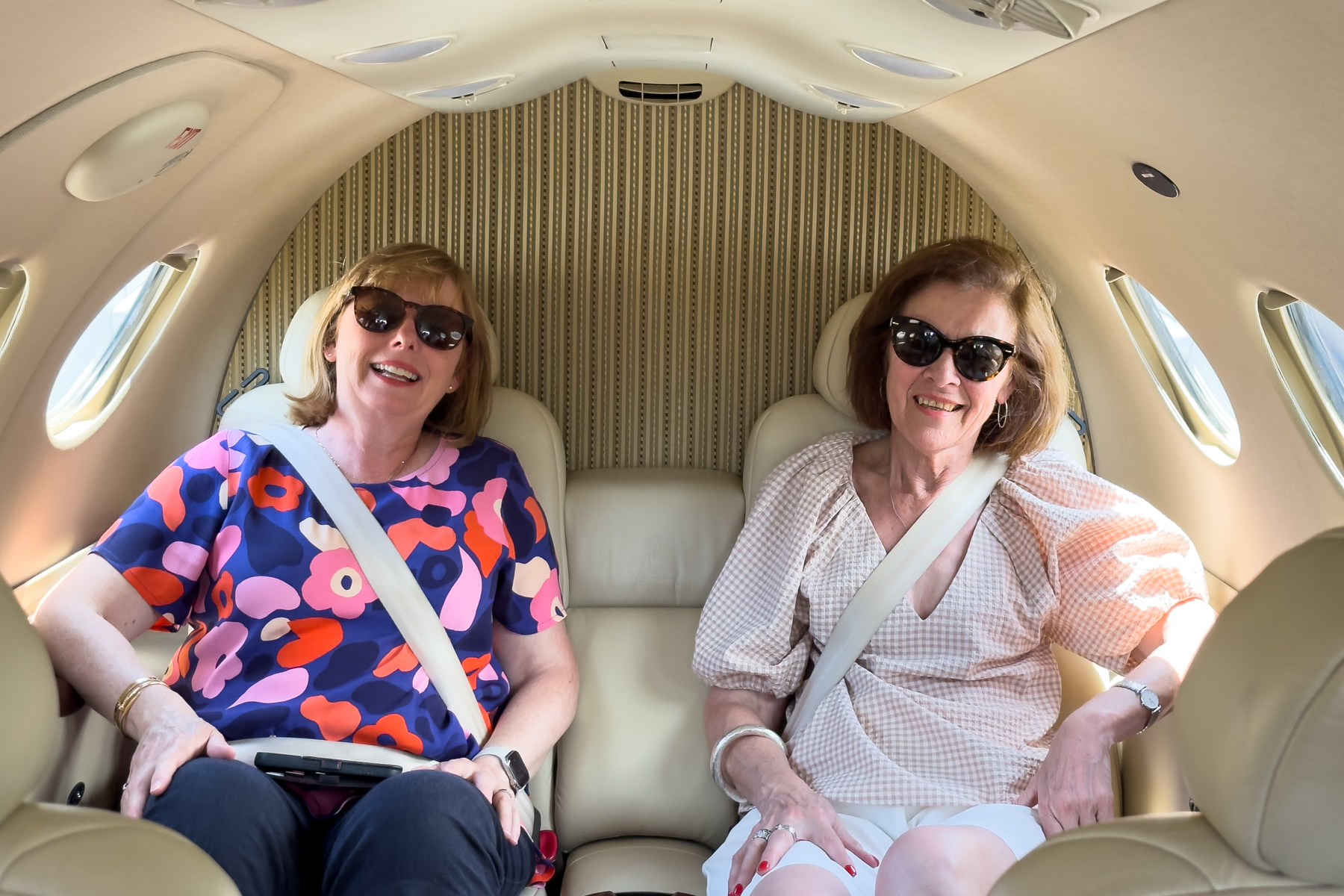 Andrea and Joy relaxing on the flight.