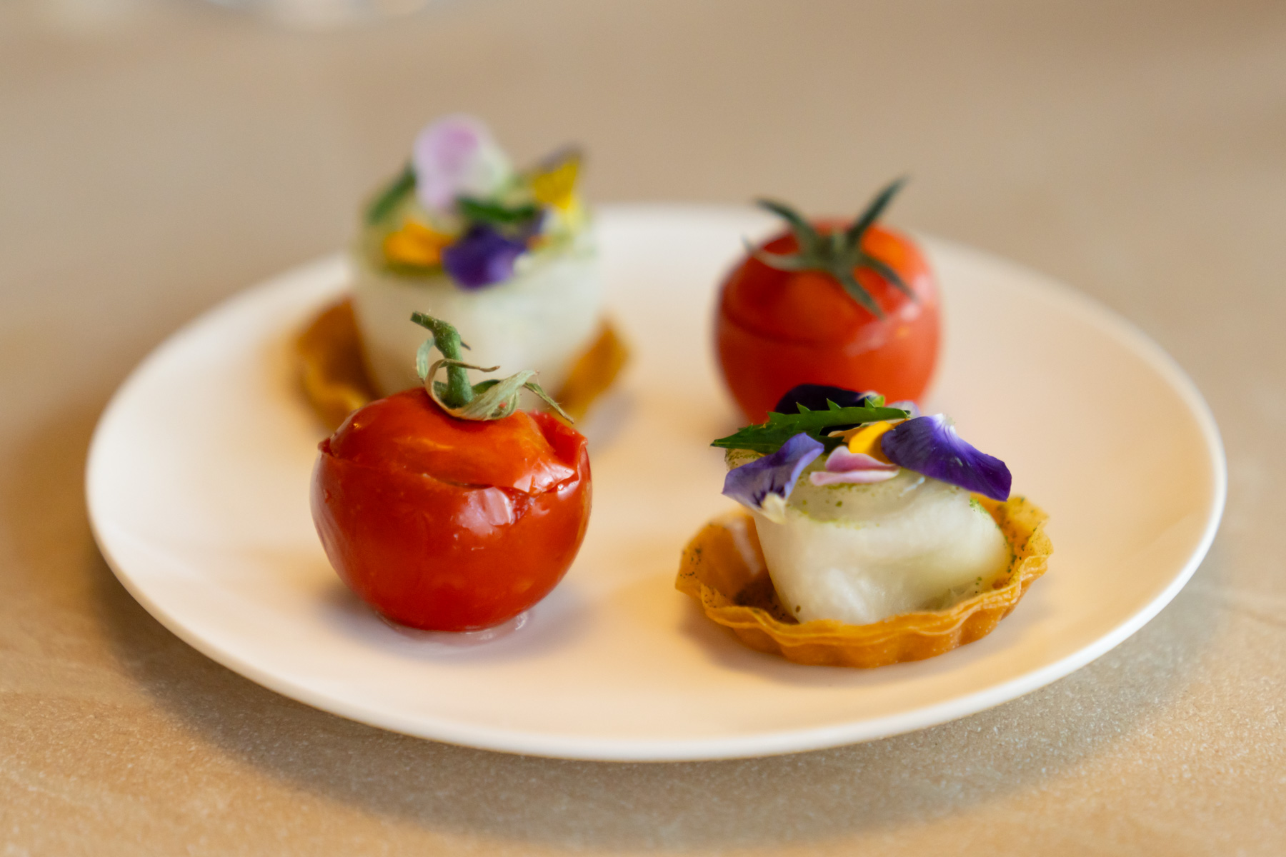 Cherry tomato, teff, lemon & lovage, with tart of fermented kohlrabi, hemp seed puree, apple marigold.
